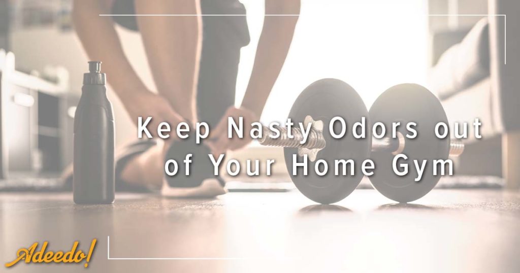 Image: a person tying their shoes next to a hand weight, cover image for Keep Nasty Odors out of Your Home Gym.