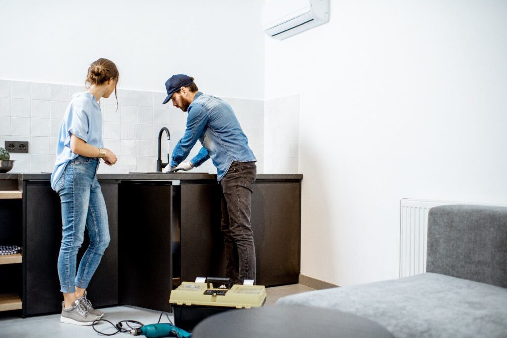 professional plumbing fixing a kitchen sink issue